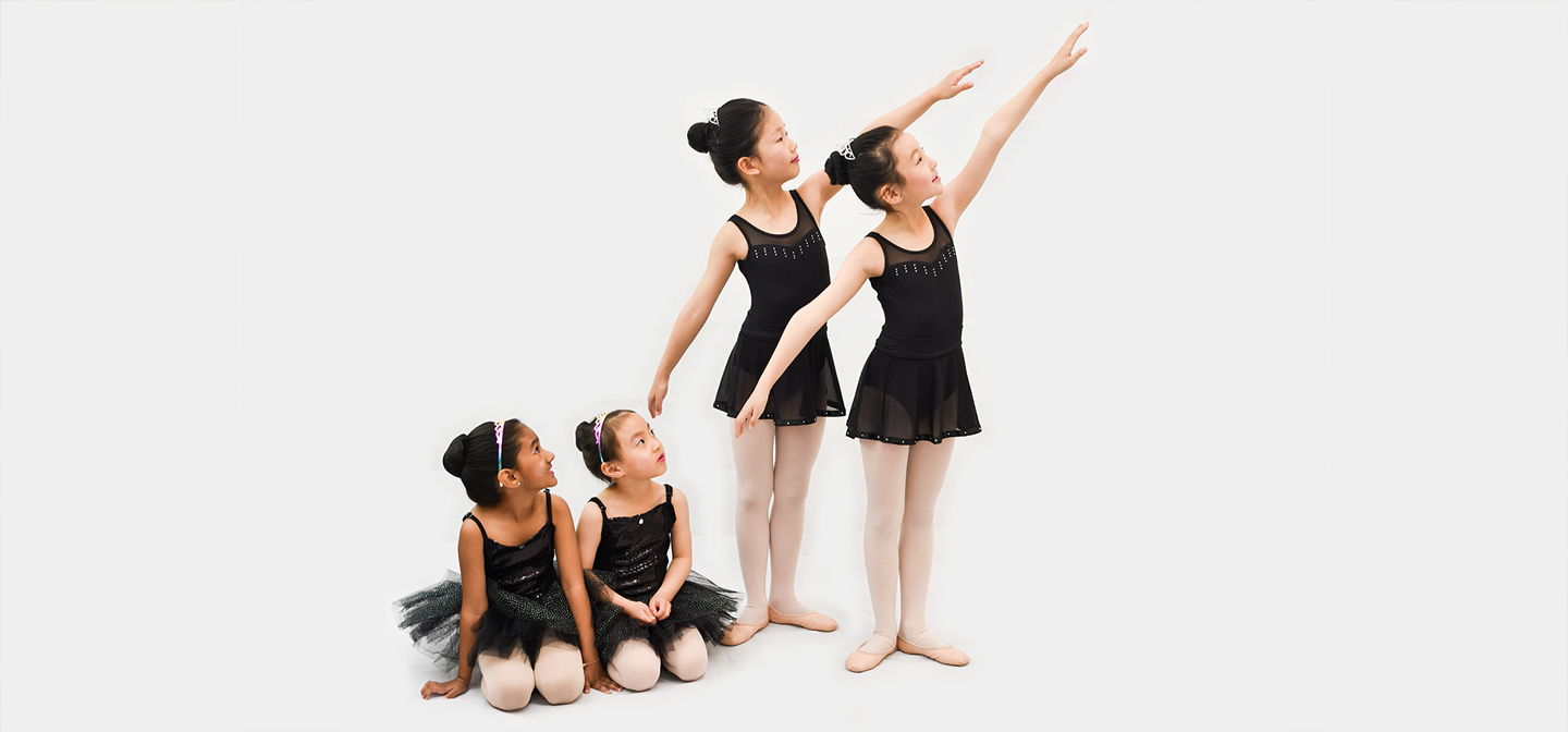 Pre-primary students watching older standing students